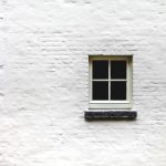 white wall with window close-up photography