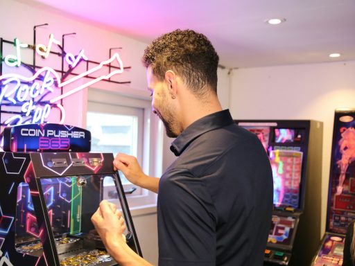 A man is playing a video game in a room